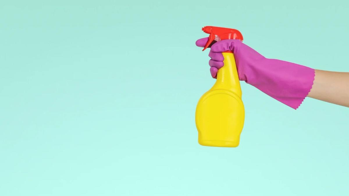 Brand communication strategy shown by a person cleaning a sparkling glass surface