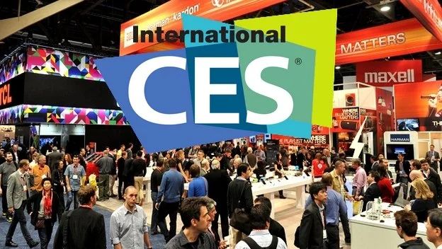 People navigating a vibrant trade show floor, highlighting the latest tech innovations