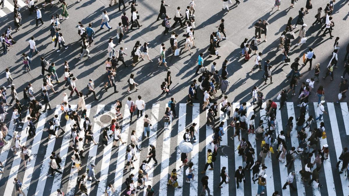 A diverse group of people engaged in consumer behavior and decision-making