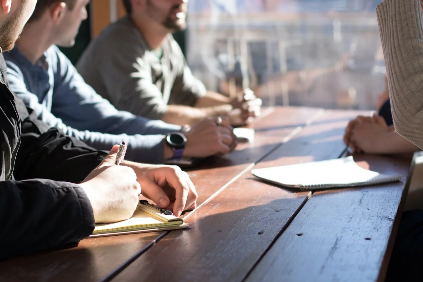 Corporate marketing professionals collaborate in a modern office space, strategizing for 2020 campaigns