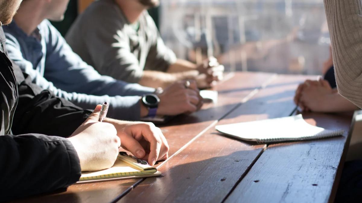 Corporate marketing professionals collaborate in a modern office space, strategizing for 2020 campaigns