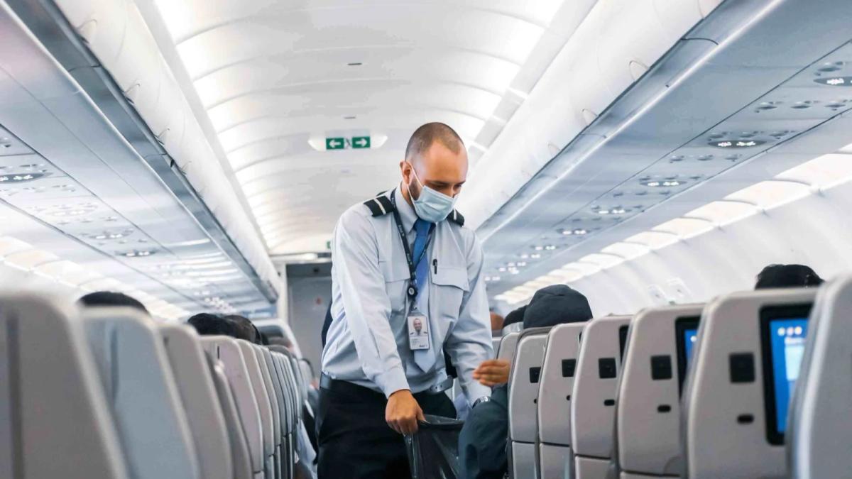 Airline employee assisting a passenger at a check-in counter