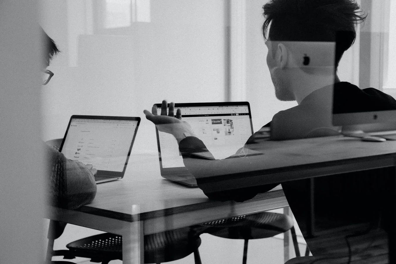 A person types on a laptop, illustrating common digital marketing activities