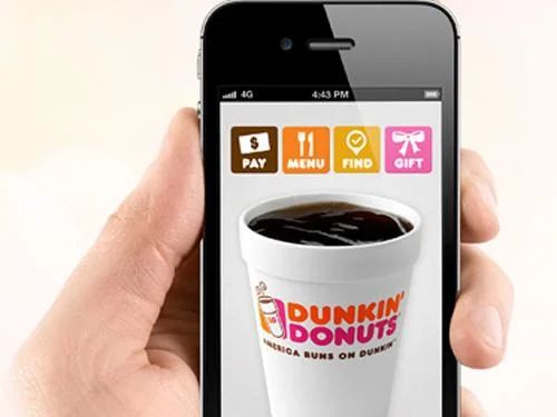 Dunkin' Donuts customer uses a smartphone to place a mobile order for coffee and donuts