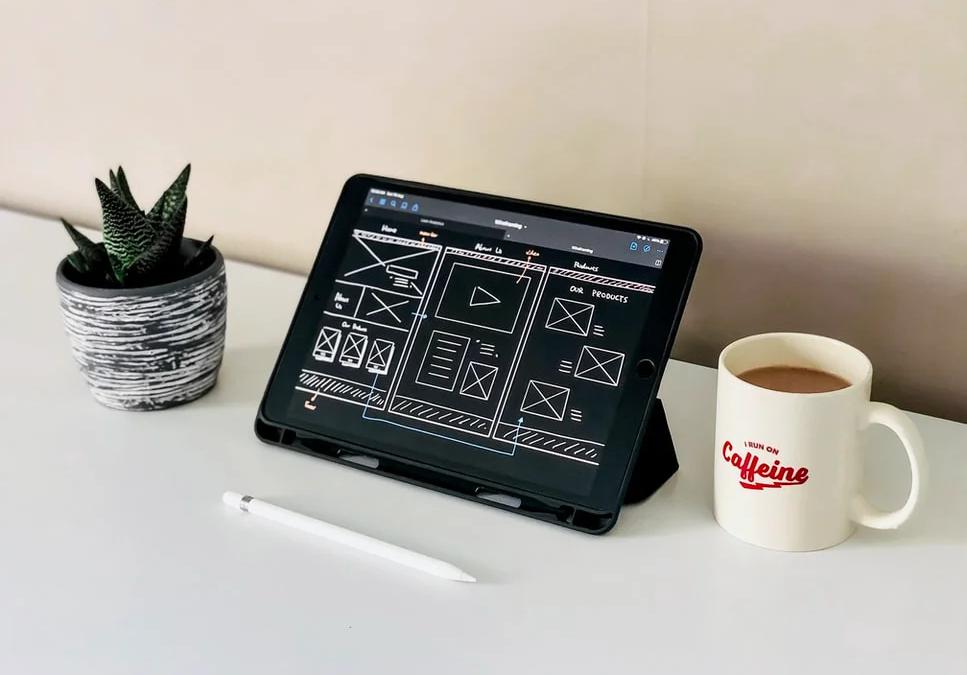 Laptop displaying a clean, well-structured website layout, showcasing effective design principles