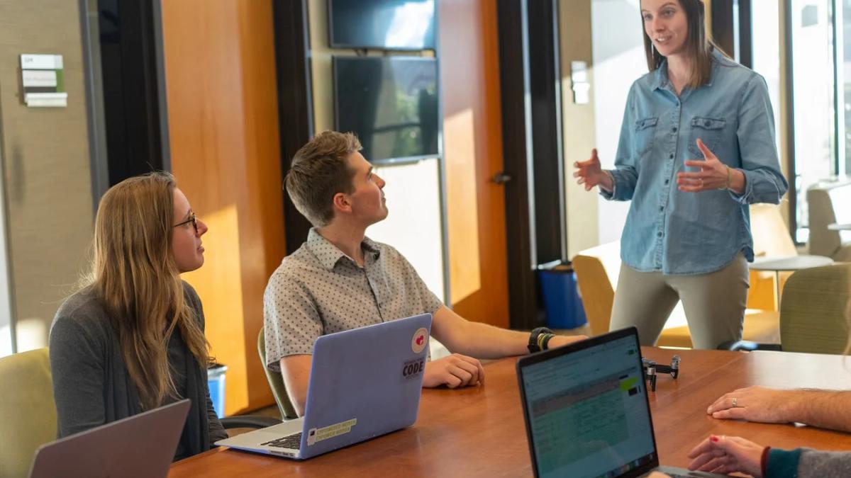 A diverse team celebrates success, illustrating the power of employee advocacy for ROI