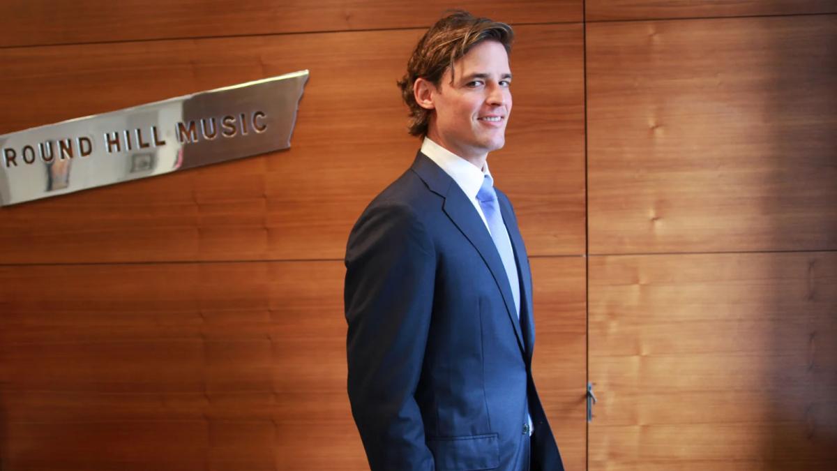 Joshua Gruss, Round Hill Music CEO, in an executive business portrait in an office