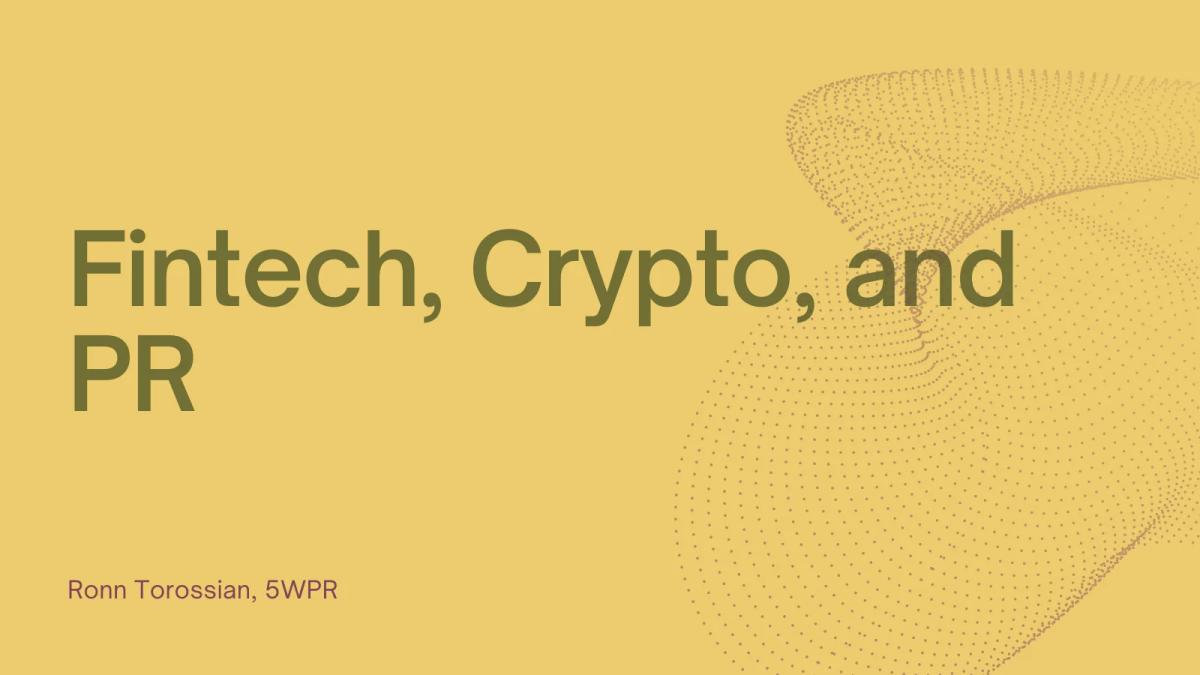Fintech: hand holding a phone displaying cryptocurrency graphs for PR communication