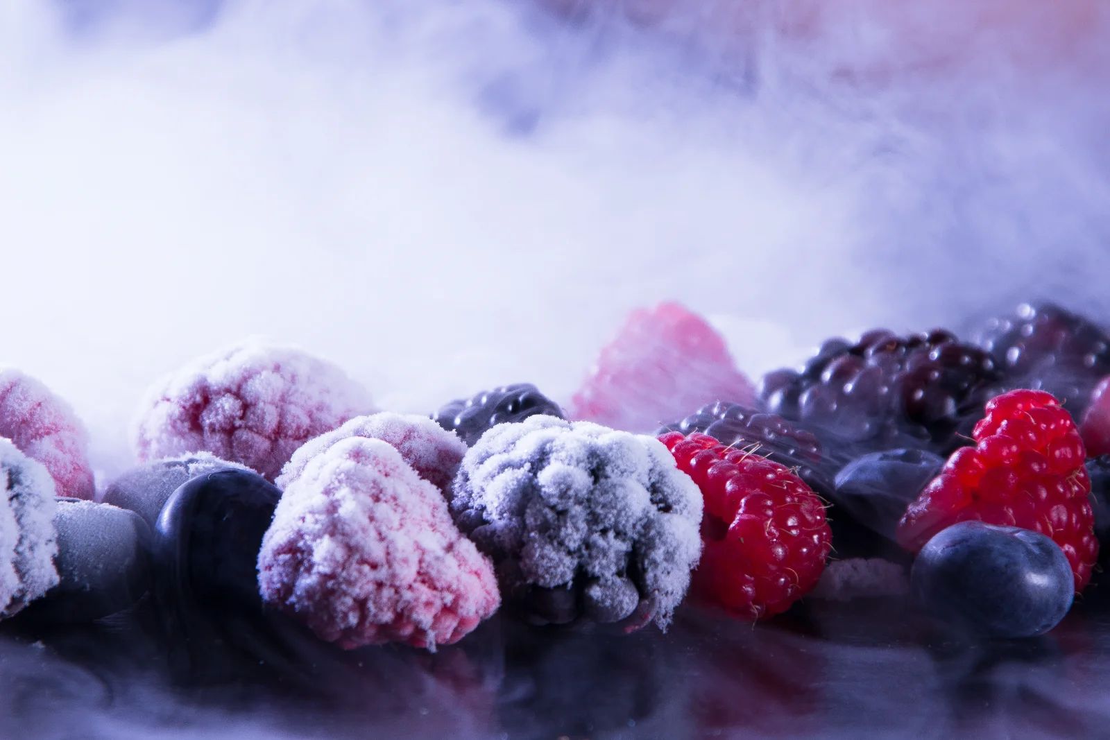 Frozen food recall: hands sorting through packages on a factory line