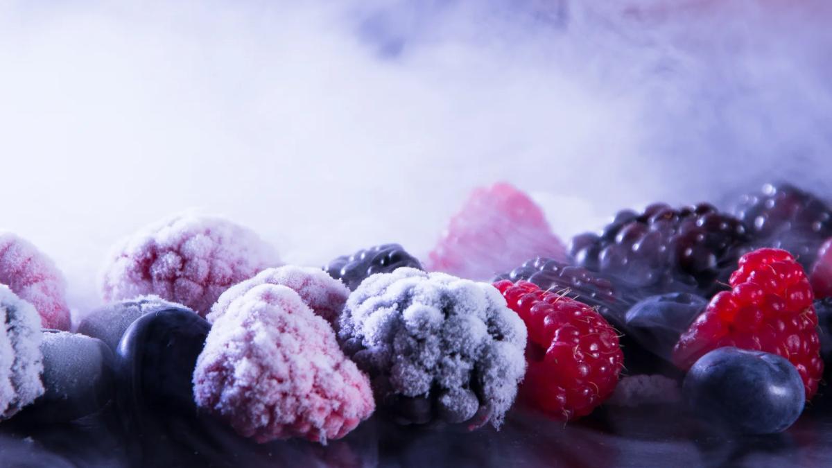 Frozen food recall: hands sorting through packages on a factory line
