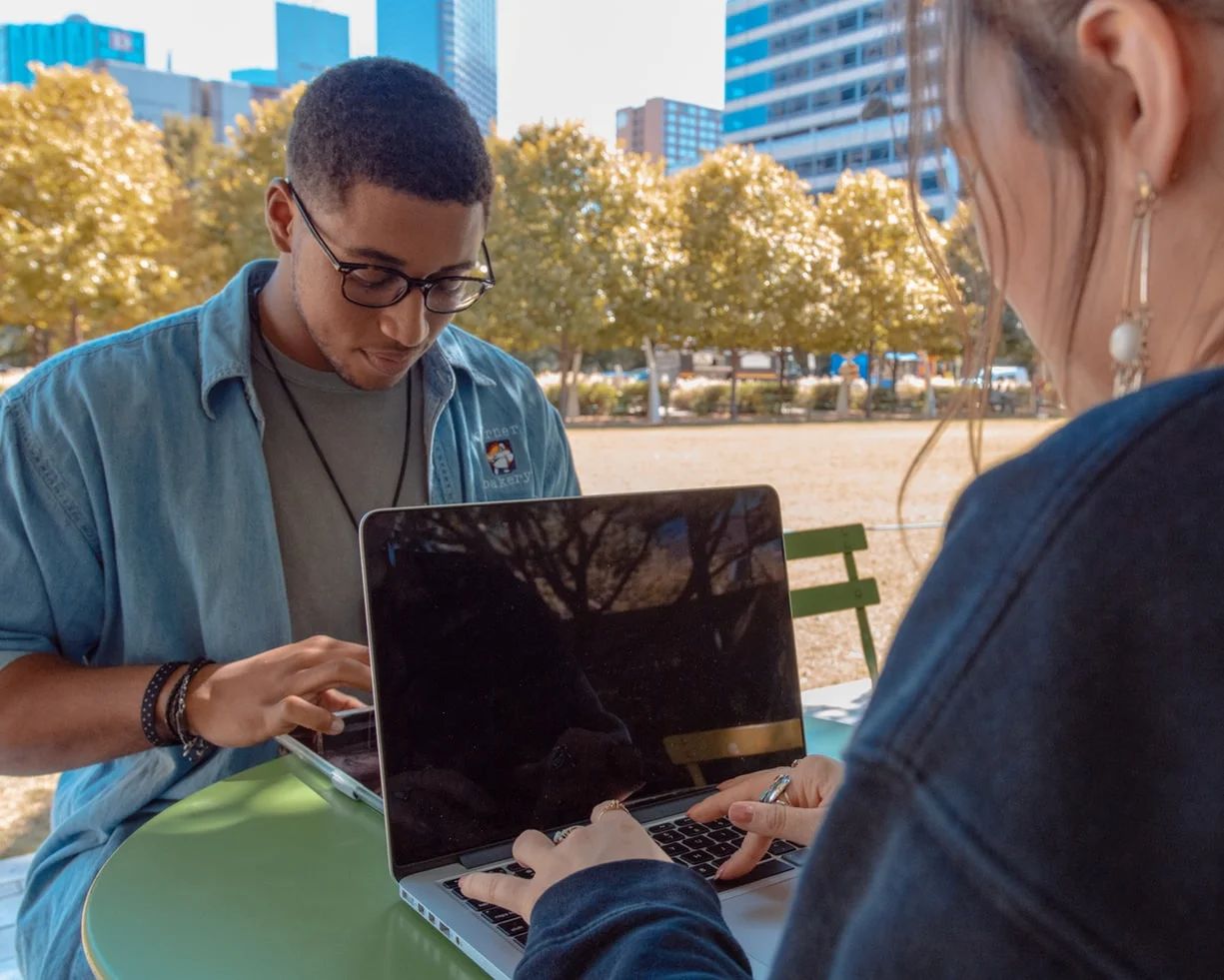 Diverse Gen Z individuals engaging with technology and social media for marketing strategies