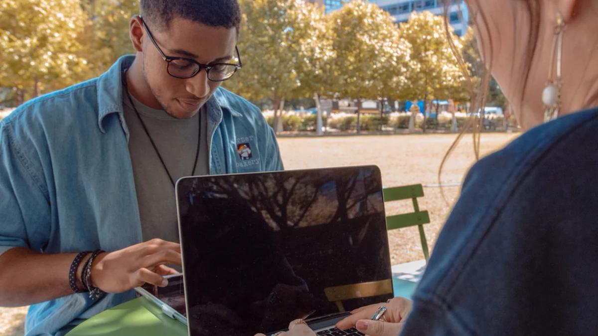 Diverse Gen Z individuals engaging with technology and social media for marketing strategies