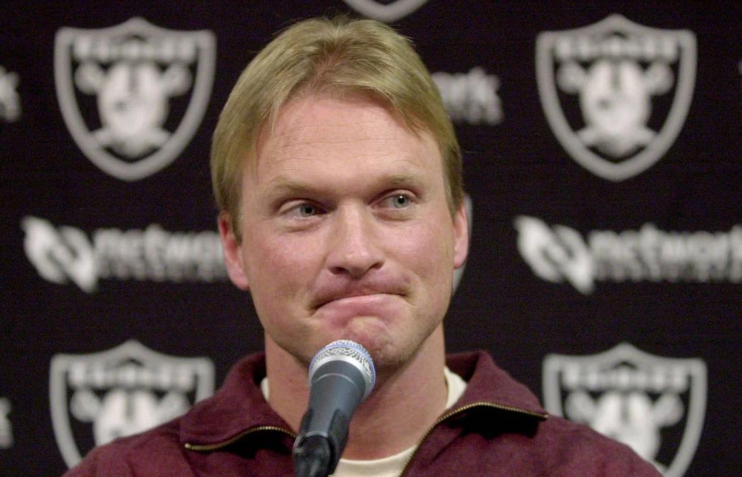 Jon Gruden in a football stadium, considering a return to coaching