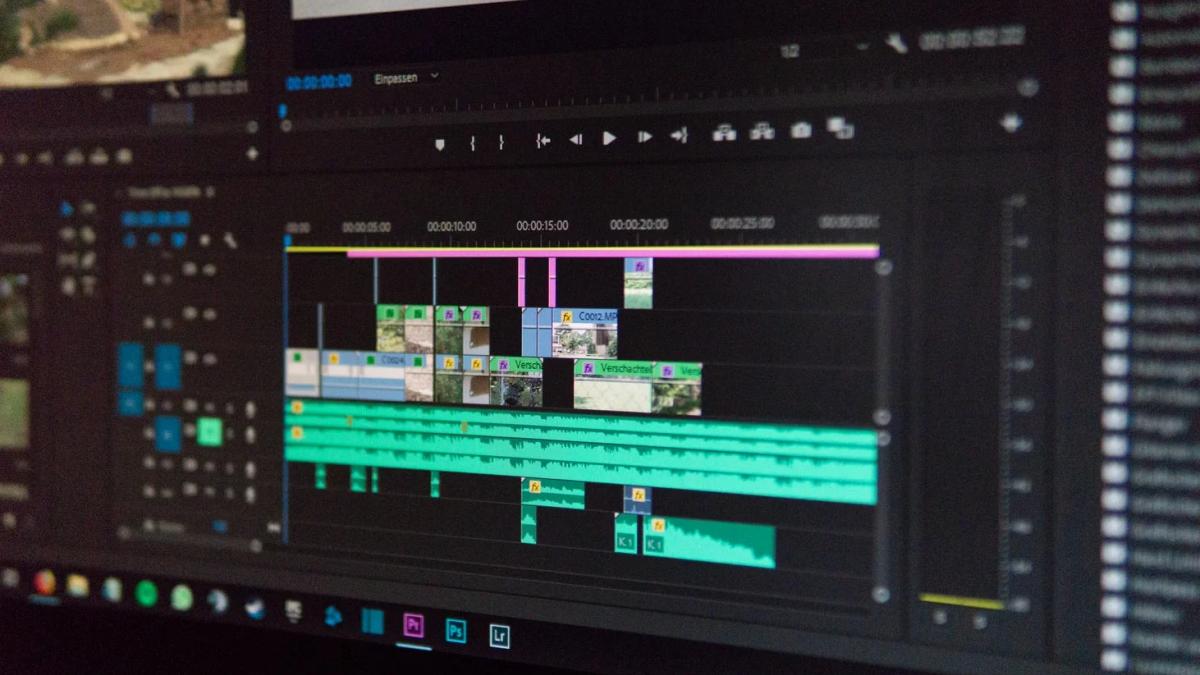 Hands adjusting video marketing tactics on a digital screen, showcasing business growth strategies