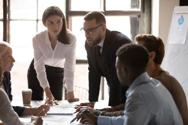 A dedicated salesperson meticulously organizing a complex customer relationship management system