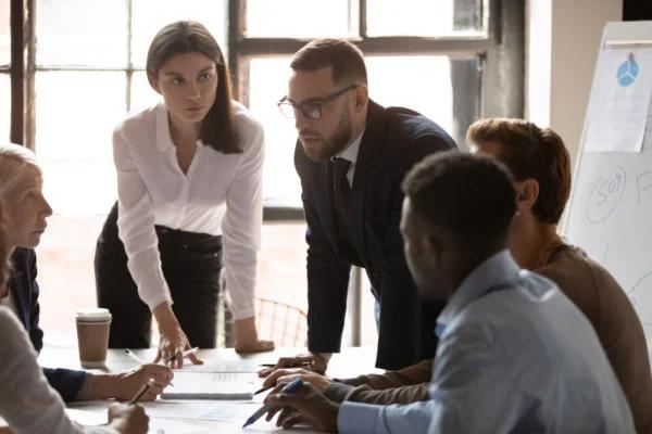 A dedicated salesperson meticulously organizing a complex customer relationship management system