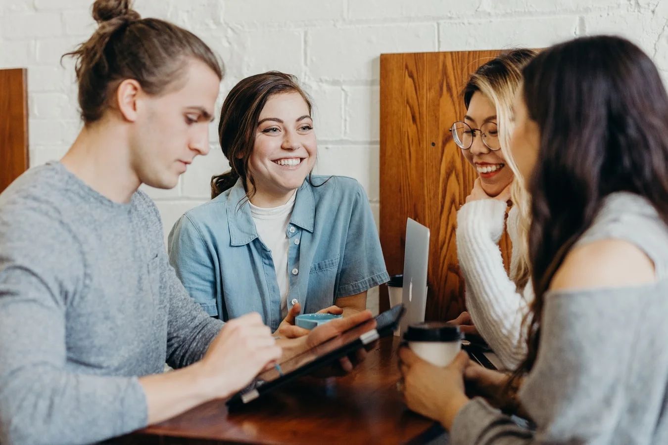 A diverse team of business professionals collaborating and communicating in an office setting