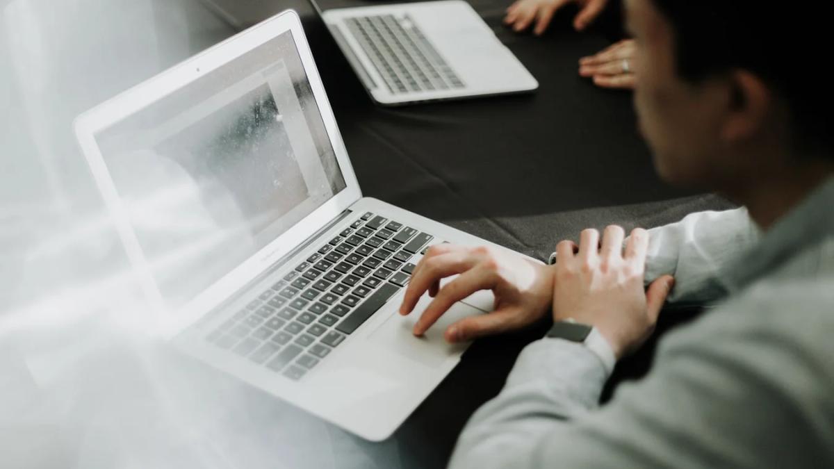 A diverse group of professionals collaborating in a modern, brightly lit office environment