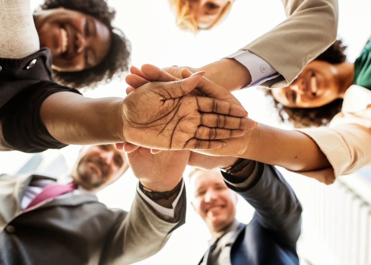 Diverse group of professionals collaborating, representing different backgrounds and skills in a workplace