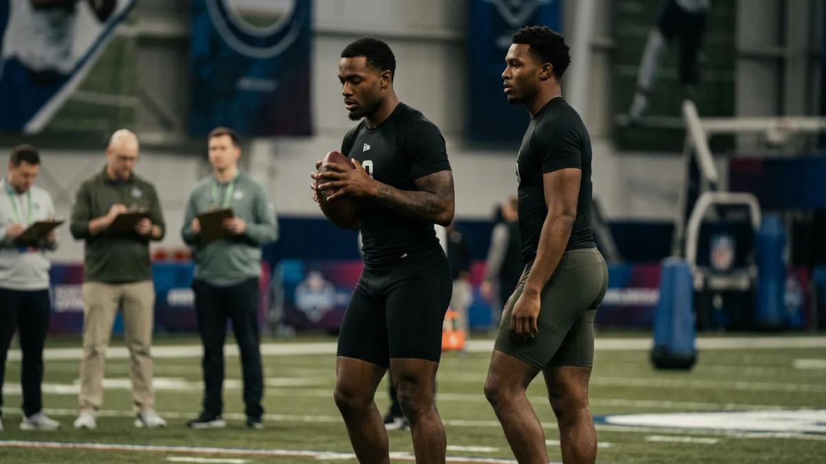 Two football players in uniforms compete, hinting at the NFL Scouting Combine rivalries