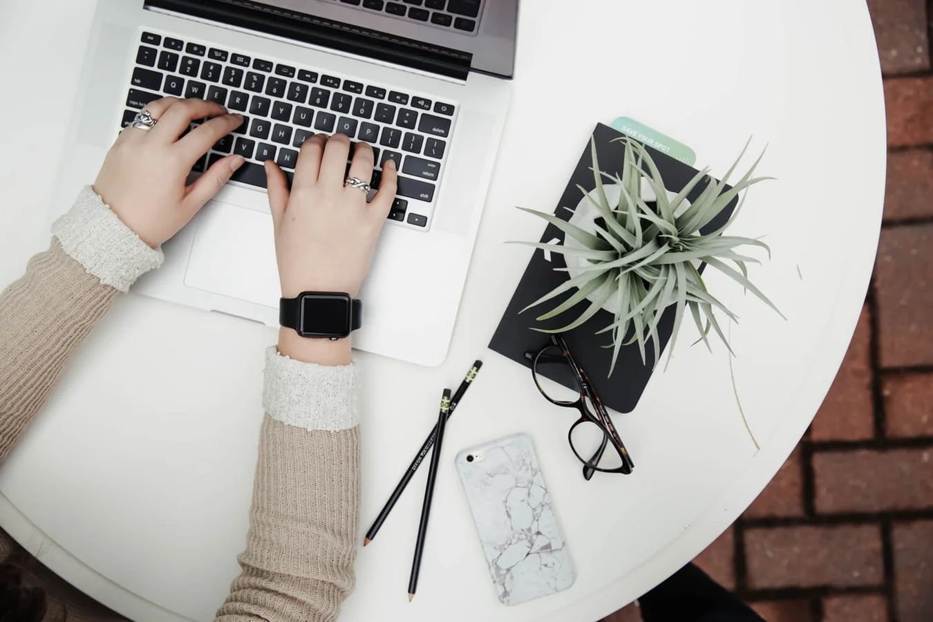 Marketers look glumly at a burnt-out marketing strategy on a scorched laptop