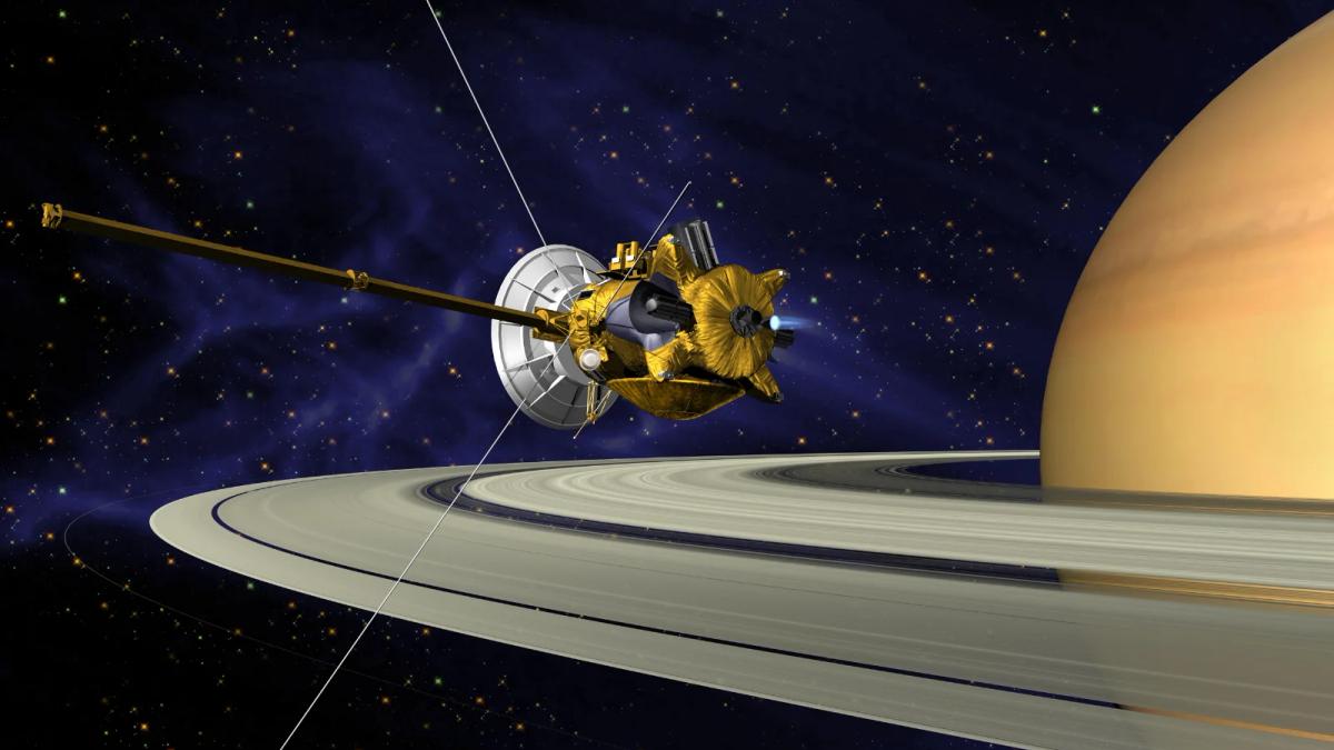 NASA engineer examining spacecraft model, planning future deep space missions