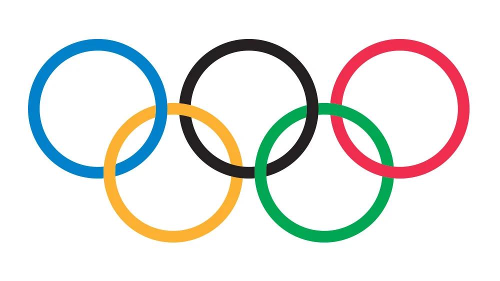 Olympic rings, a symbol of sport and integrity, against a stadium backdrop