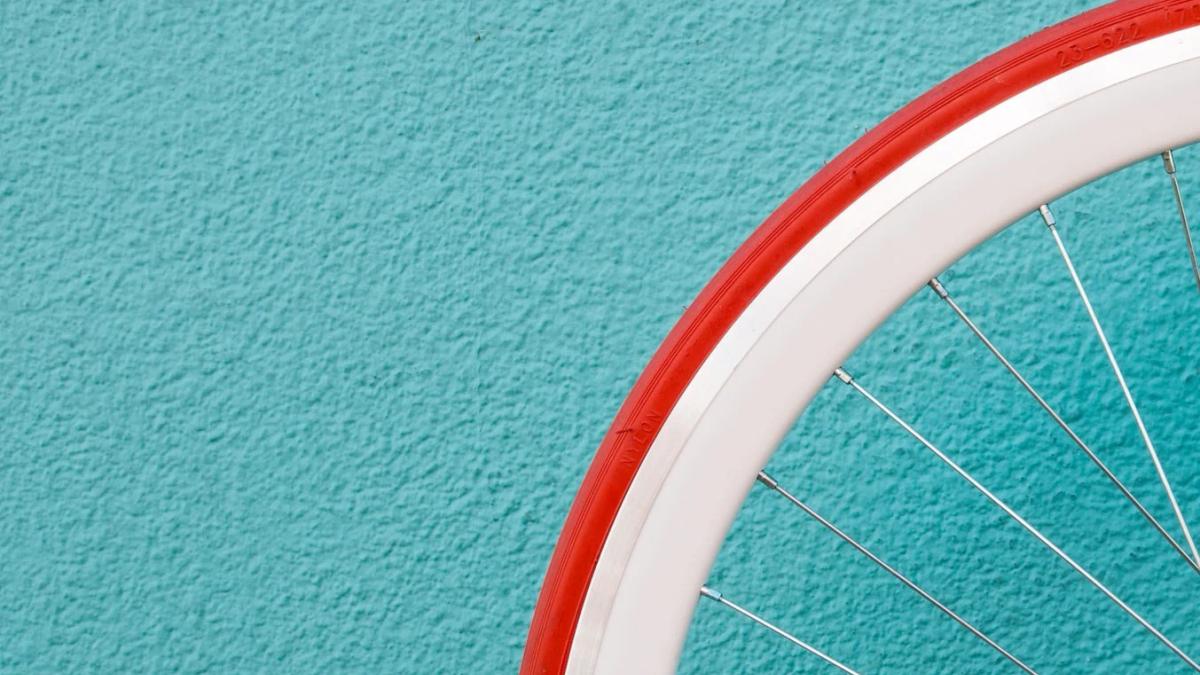Distraught woman staring at her Peloton bike represents consumer dissatisfaction and marketing missteps