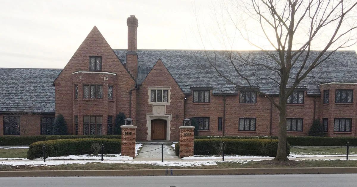 Penn State fraternity members in suits, facing ongoing challenges and uncertain future