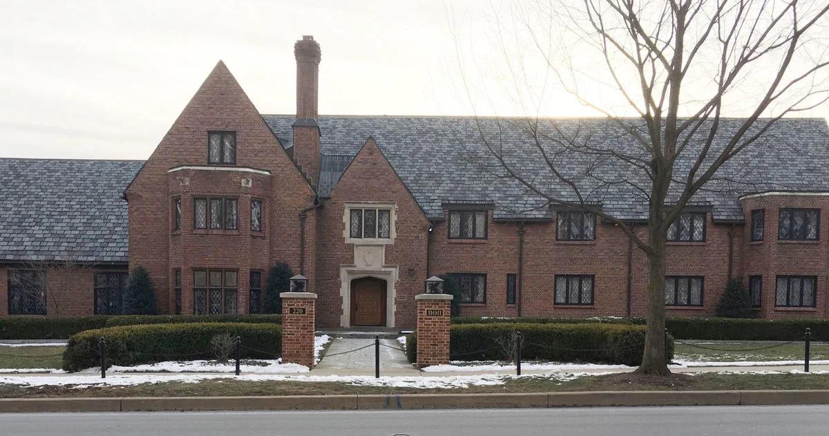 Penn State fraternity members in suits, facing ongoing challenges and uncertain future