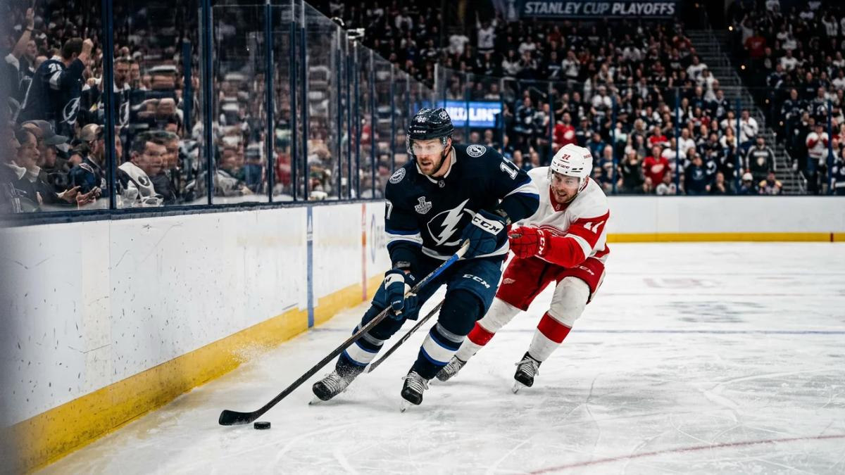 A hockey player takes a powerful shot on goal during the NHL playoffs