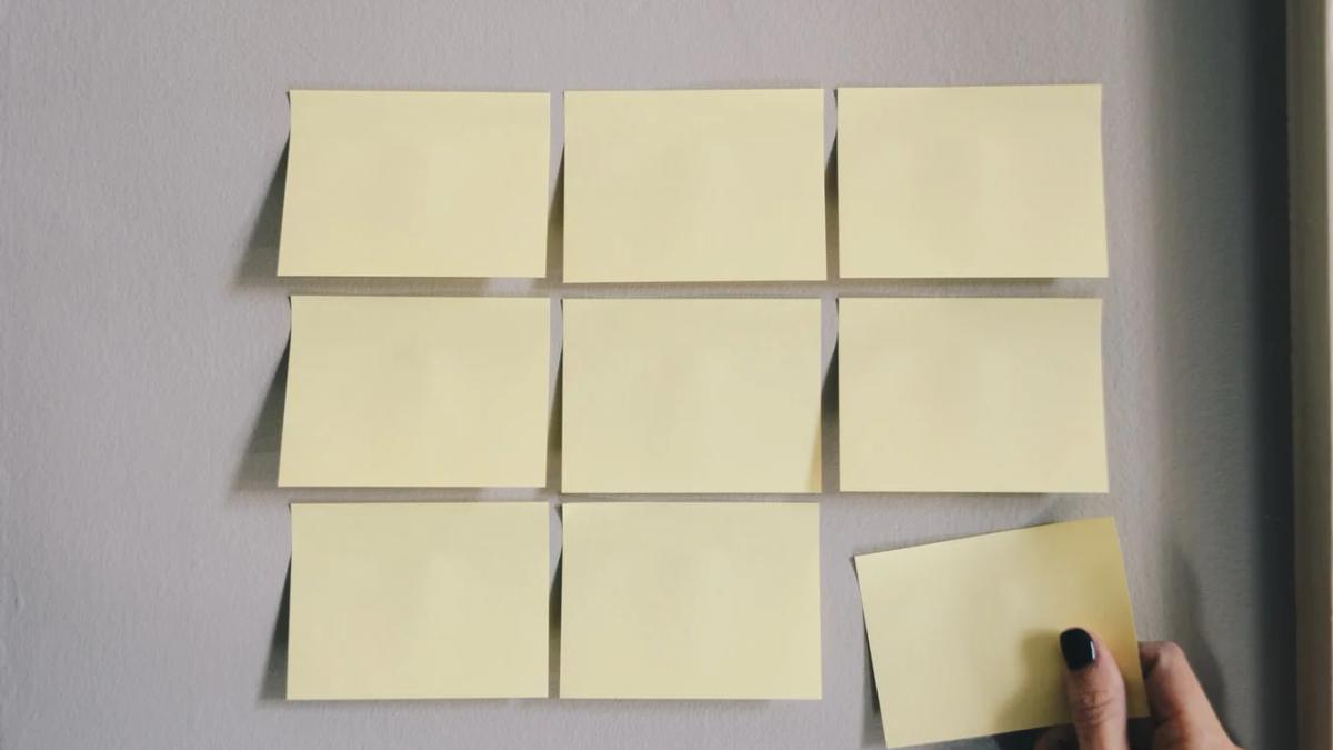 Team facing a whiteboard with a PR crisis to-do list