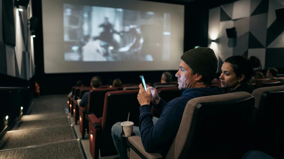 A person reclines with 3D glasses, symbolizing how streaming affects traditional moviegoing