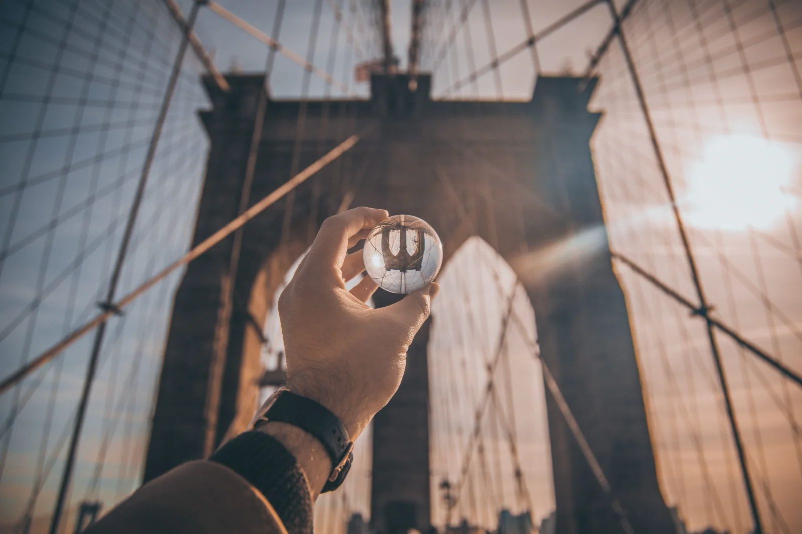 A person holding a physical house key, symbolizing the concept of ownership and belonging