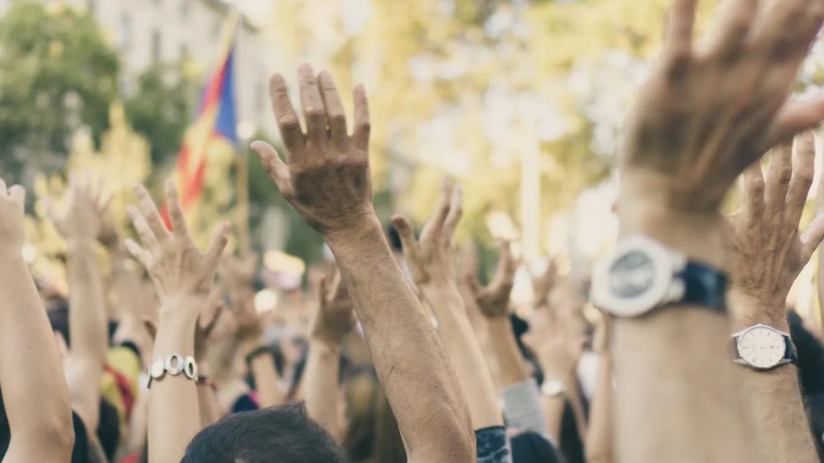 Protesters carry signs for racial justice, sparking country music group name changes