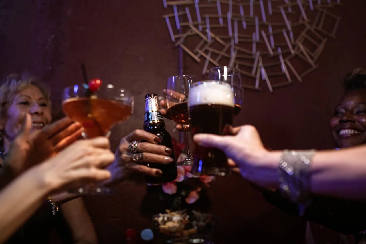 Neon-lit nightclub with energetic crowd, DJ, and flashing lights for a social media party