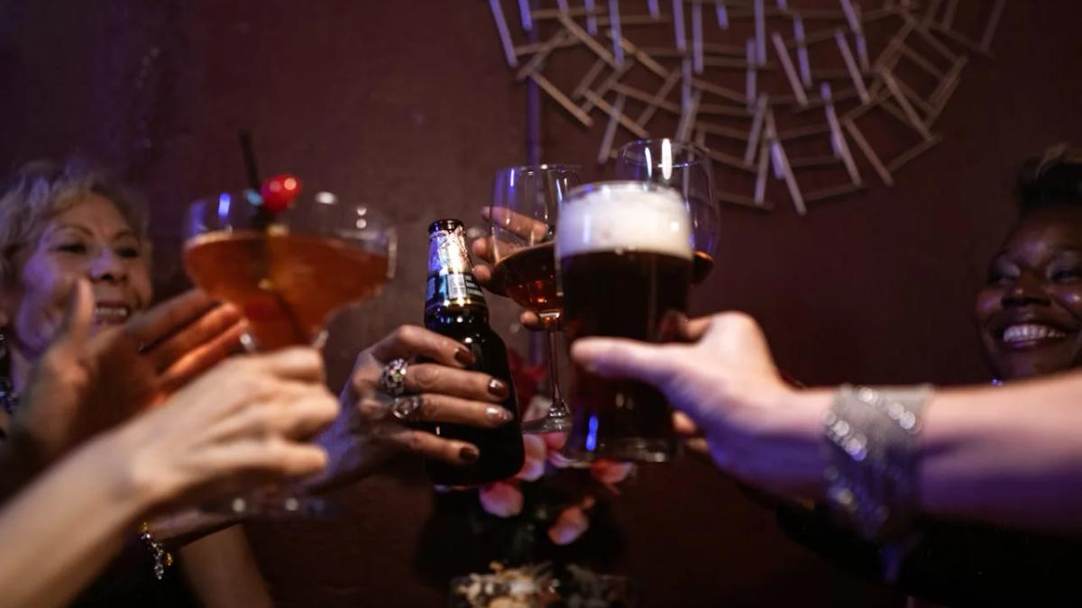 Neon-lit nightclub with energetic crowd, DJ, and flashing lights for a social media party