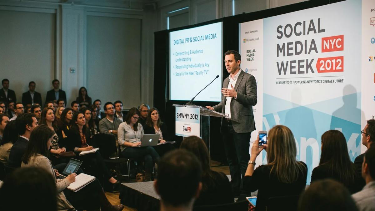 Attendees at a social media conference, discussing digital PR strategies