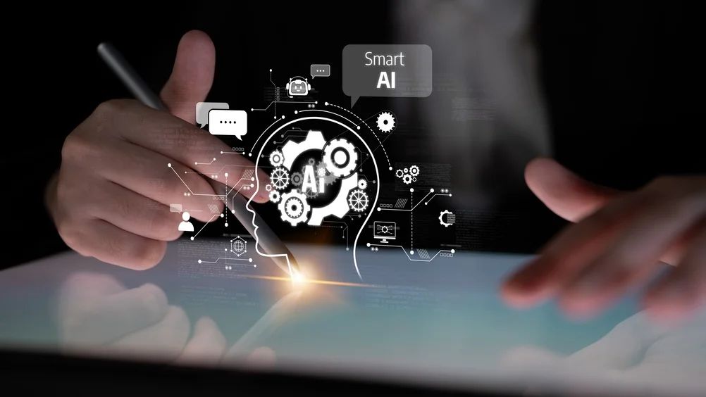 Three individuals collaborating on a laptop, illustrating brands adapting to AI search changes