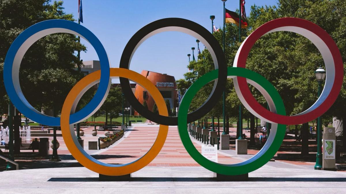 A panoramic view of the iconic Olympic rings floating in Tokyo Bay