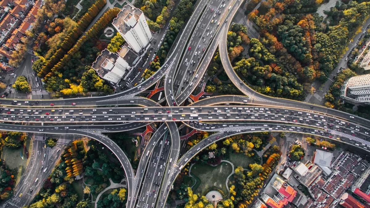 Road filled with cars, stopped in a frustrating city traffic jam