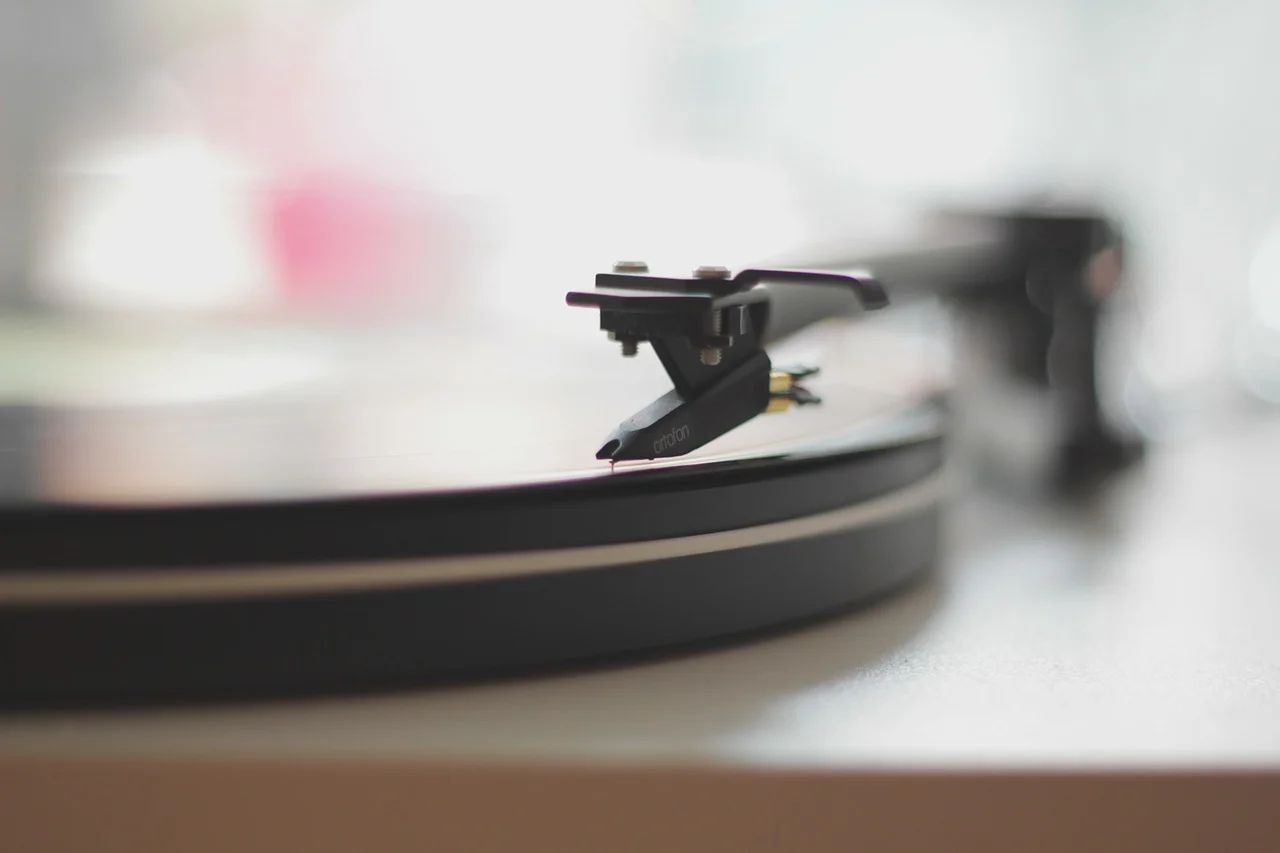 Vintage vinyl records spinning on a turntable, showcasing the music industry's resurgence