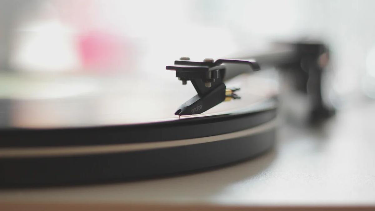 Vintage vinyl records spinning on a turntable, showcasing the music industry's resurgence