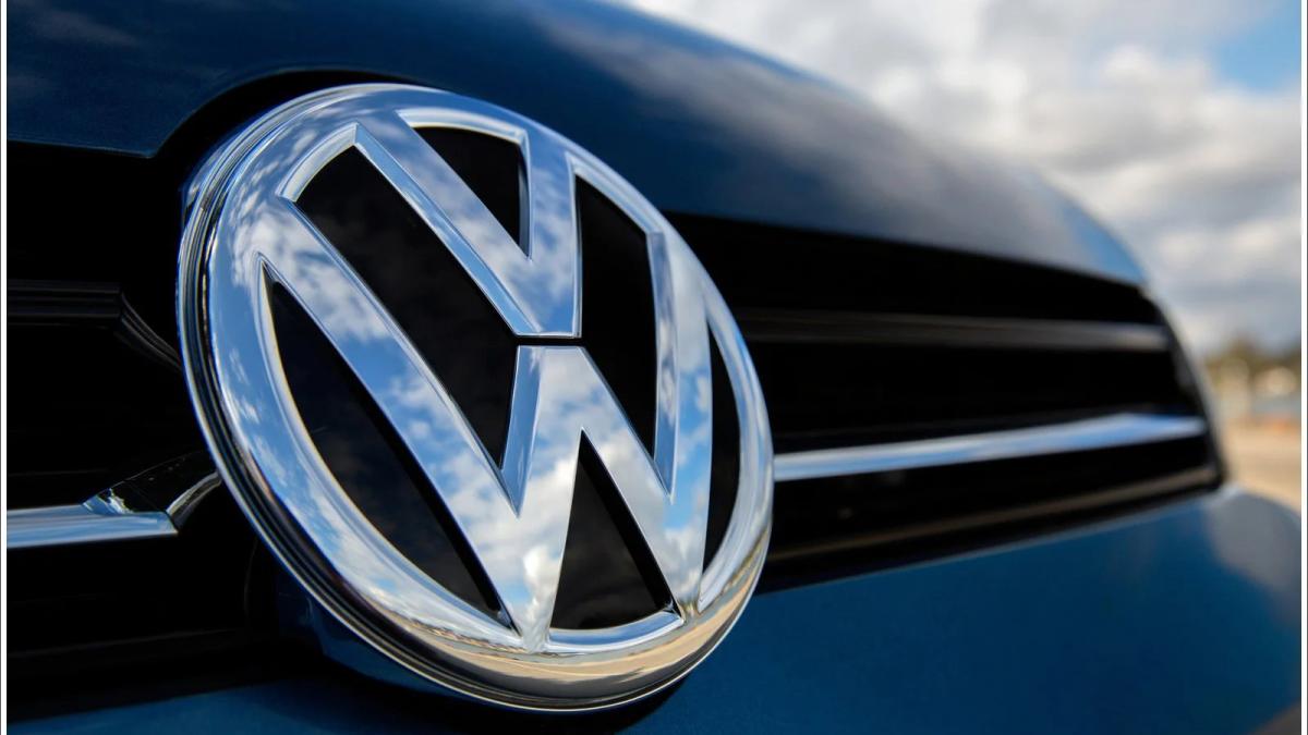 Volkswagen car on a road at sunset, symbolizing a change in direction