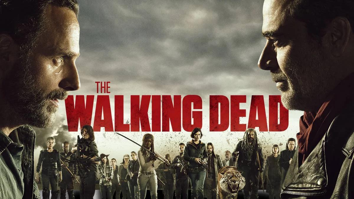A large group of diverse zombie extras on set, walking together through a city