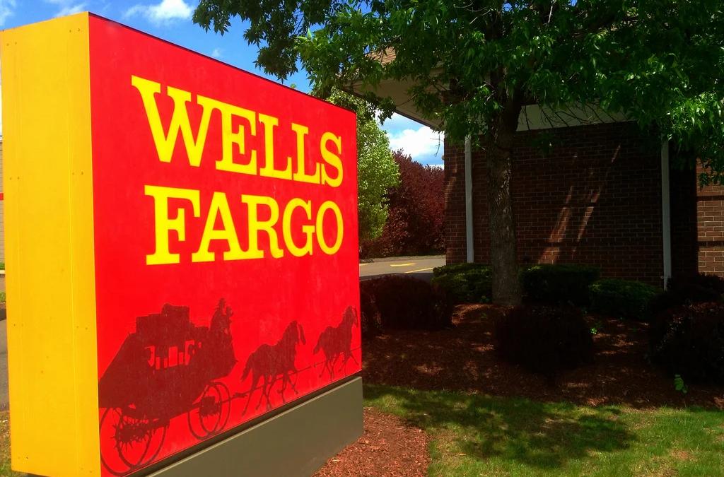 Wells Fargo's crumbling golden stagecoach logo against a dark background