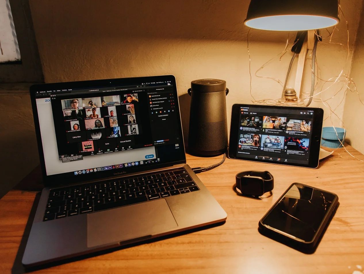 A diverse team collaborates virtually, navigating a challenging public relations crisis using Zoom